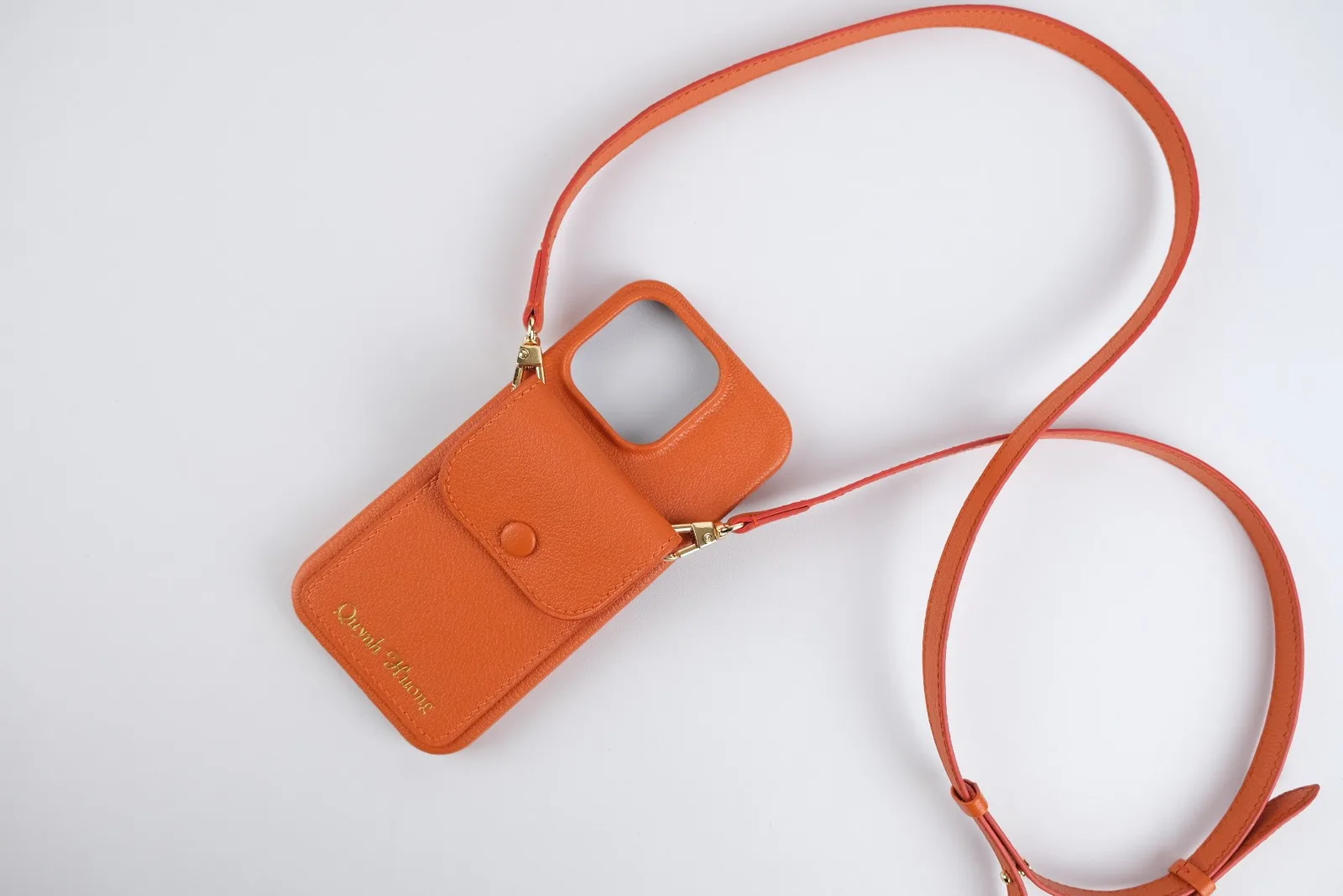 Ảnh Studio Ốp điện thoại da Togo màu cam kèm ví phụ và dây đeo - Koi Leather