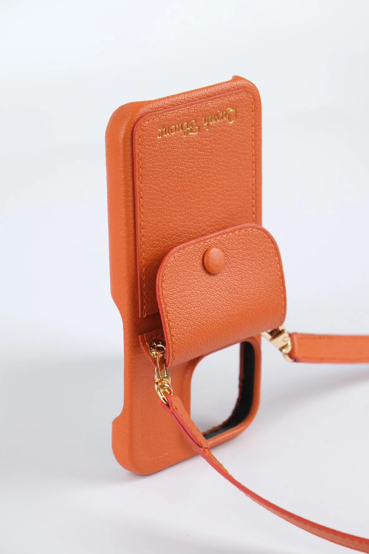 Ảnh Studio Ốp điện thoại da Togo màu cam kèm ví phụ và dây đeo - Koi Leather