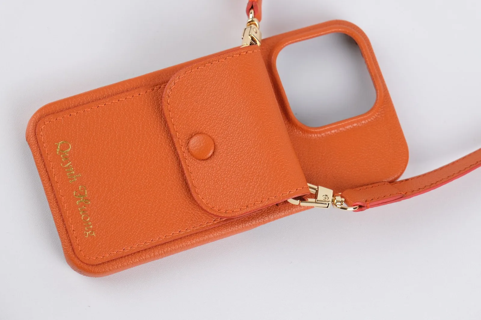 Ảnh Studio Ốp điện thoại da Togo màu cam kèm ví phụ và dây đeo - Koi Leather