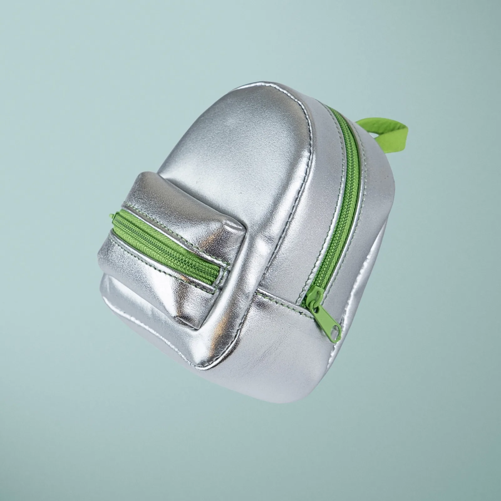 Ảnh Studio Charm đeo túi dáng balo mini da ánh kim bạc - Koi Leather