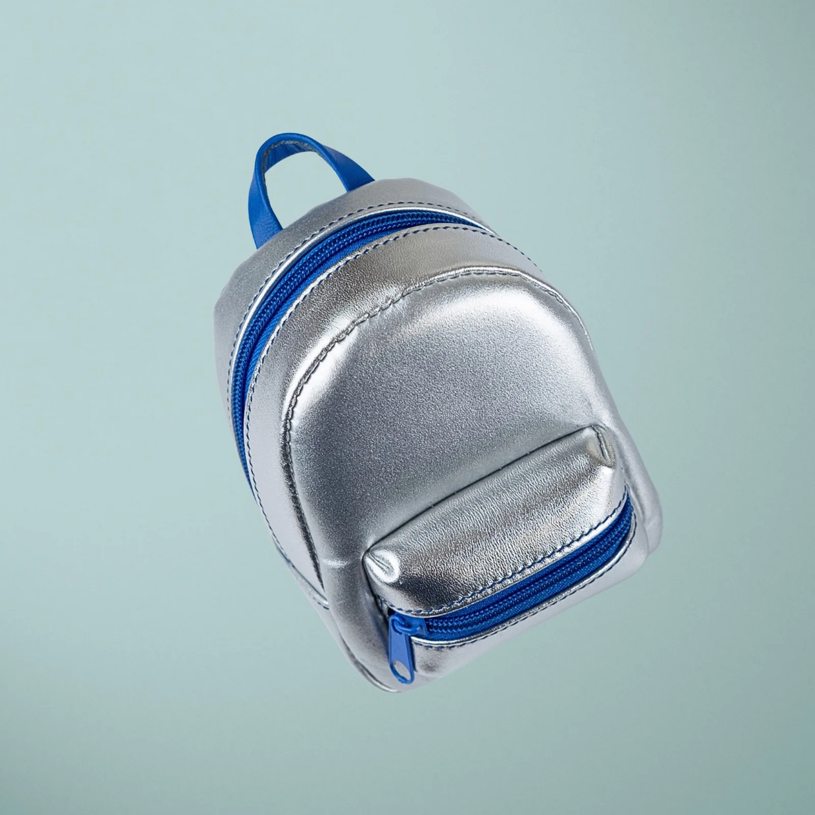 Ảnh Studio Charm đeo túi dáng balo mini da ánh kim bạc - Koi Leather