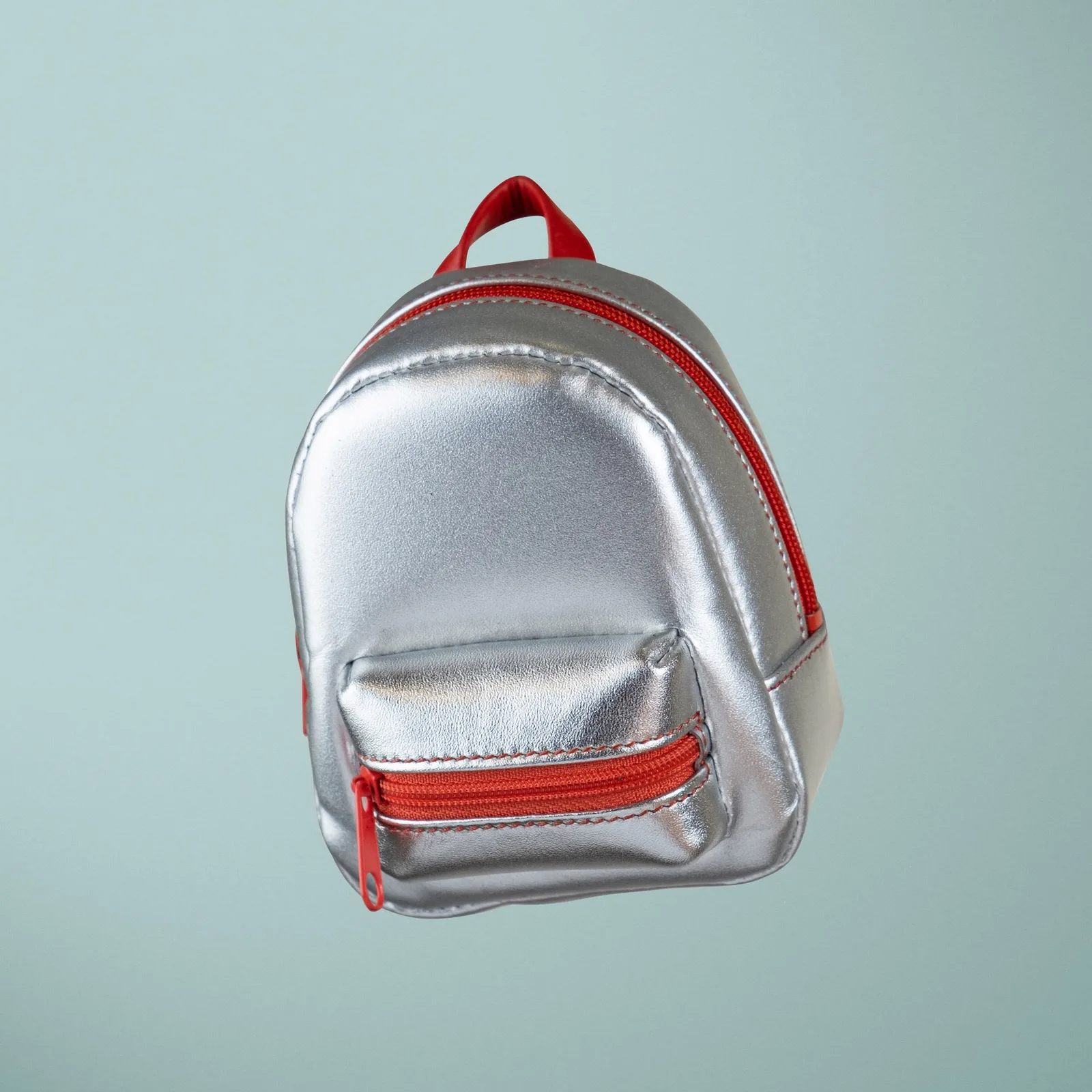 Ảnh Studio Charm đeo túi dáng balo mini da ánh kim bạc - Koi Leather