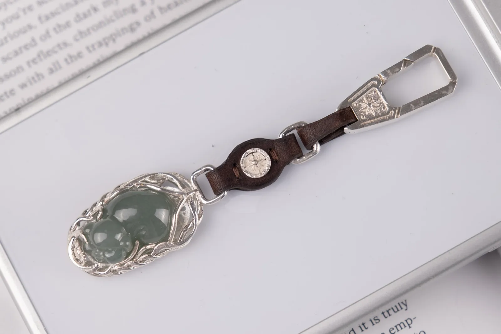 Ảnh Lifestyle Charm móc treo da nâu phối chi tiết bạc và mặt ngọc - Koi Leather