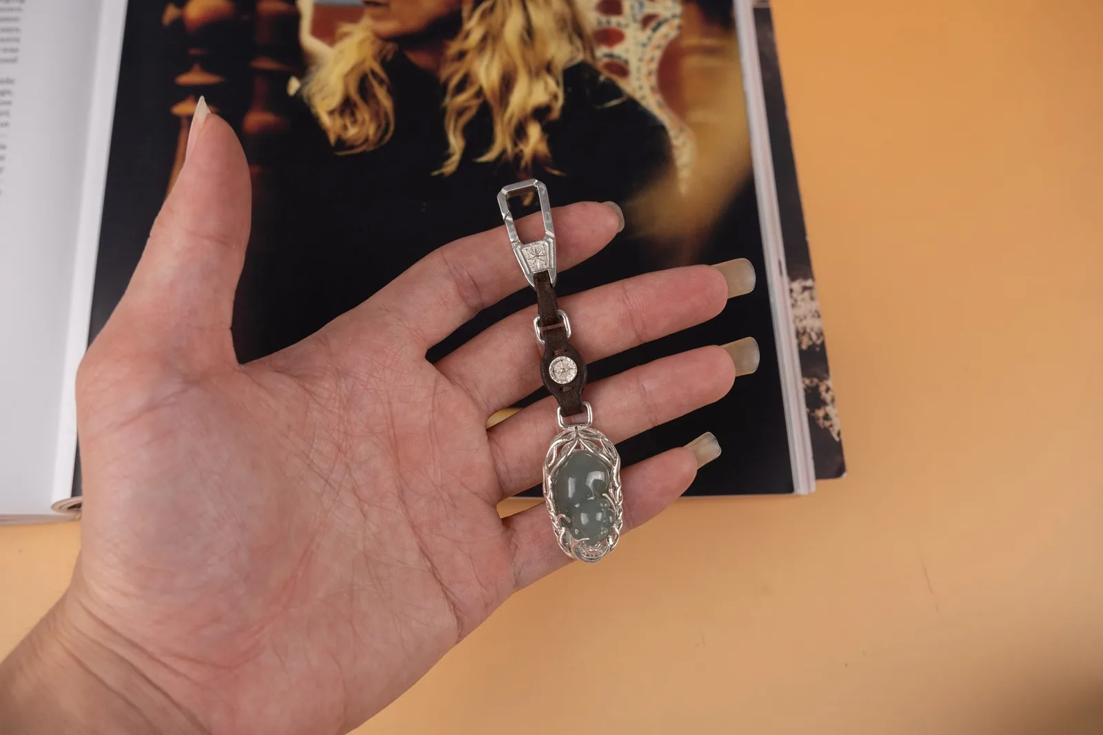 Ảnh Lifestyle Charm móc treo da nâu phối chi tiết bạc và mặt ngọc - Koi Leather