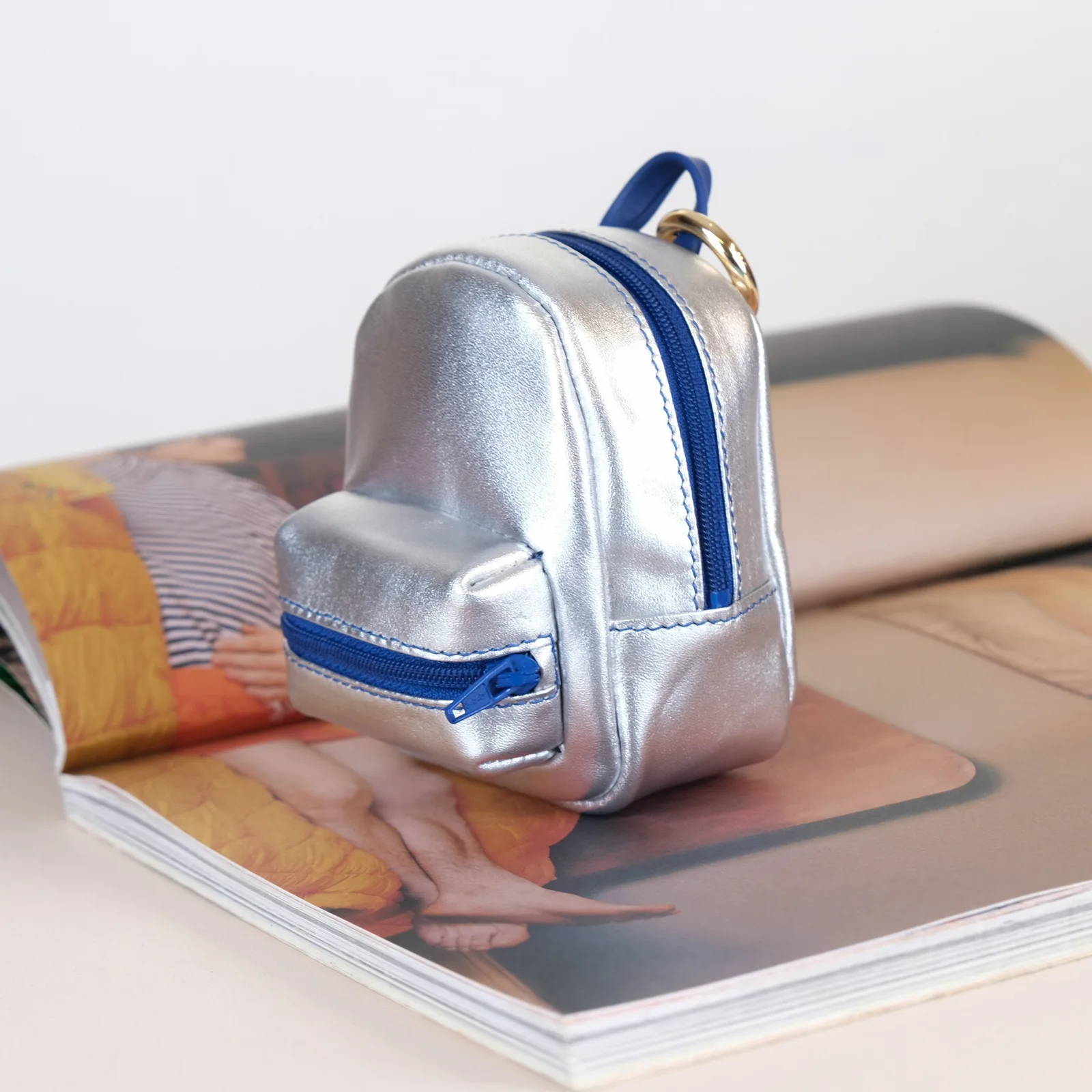 Ảnh Lifestyle Charm balo mini da màu bạc phối xanh navy - Koi Leather