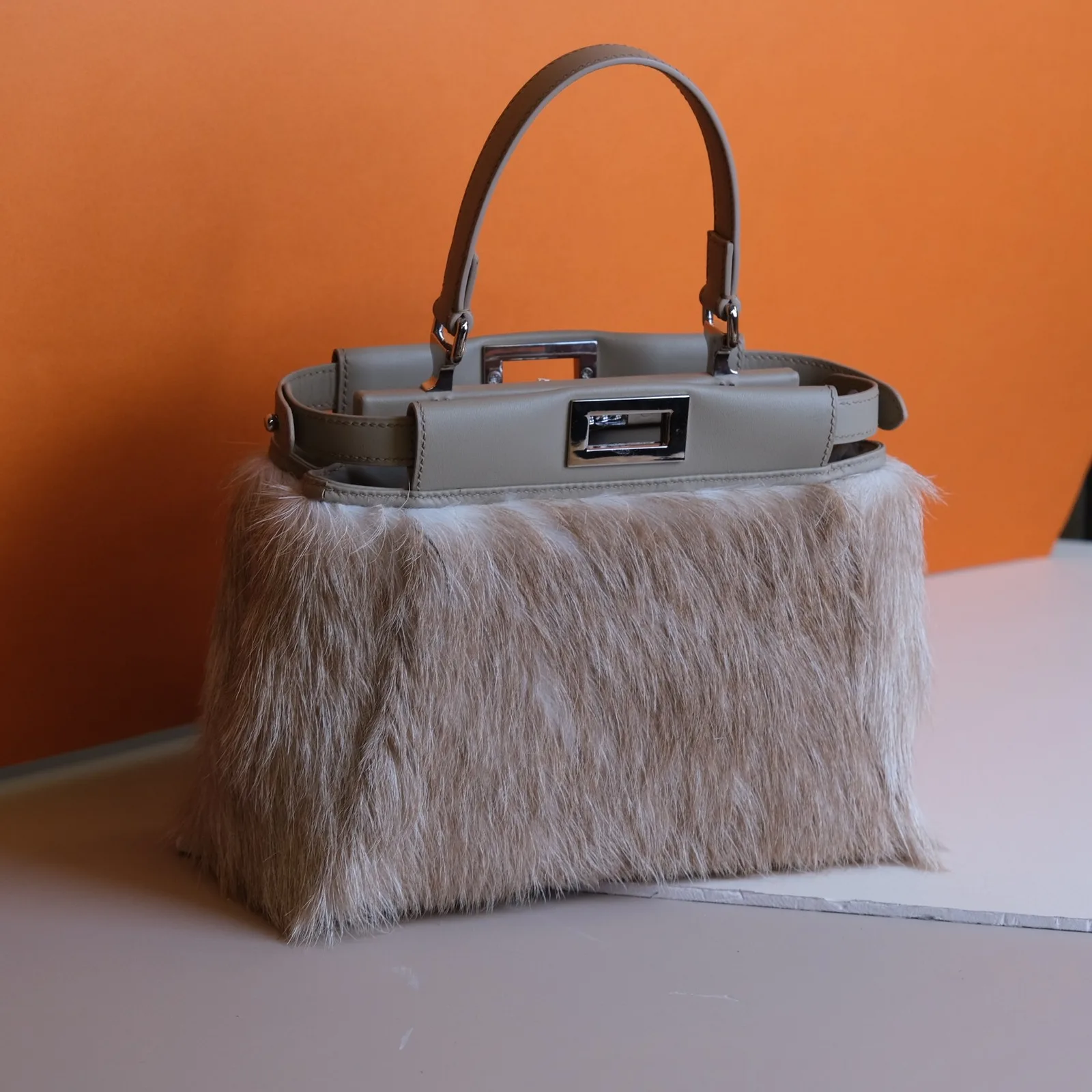 Ảnh Studio Áo bọc túi xách da bò nguyên lông màu be xám - Koi Leather