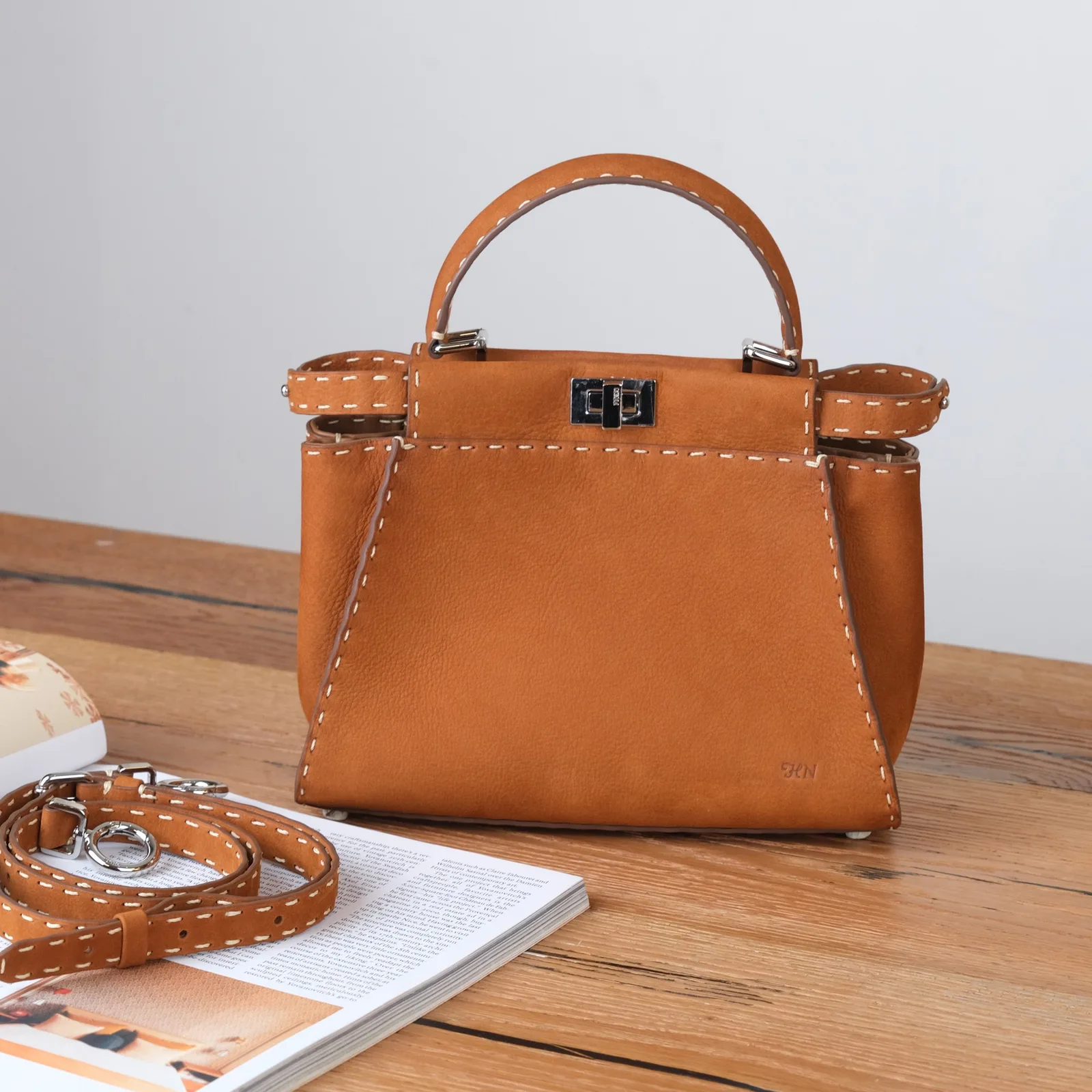 Ảnh Lifestyle Túi xách nữ da Nubuck màu vàng bò quai cầm may chỉ nổi - Koi Leather