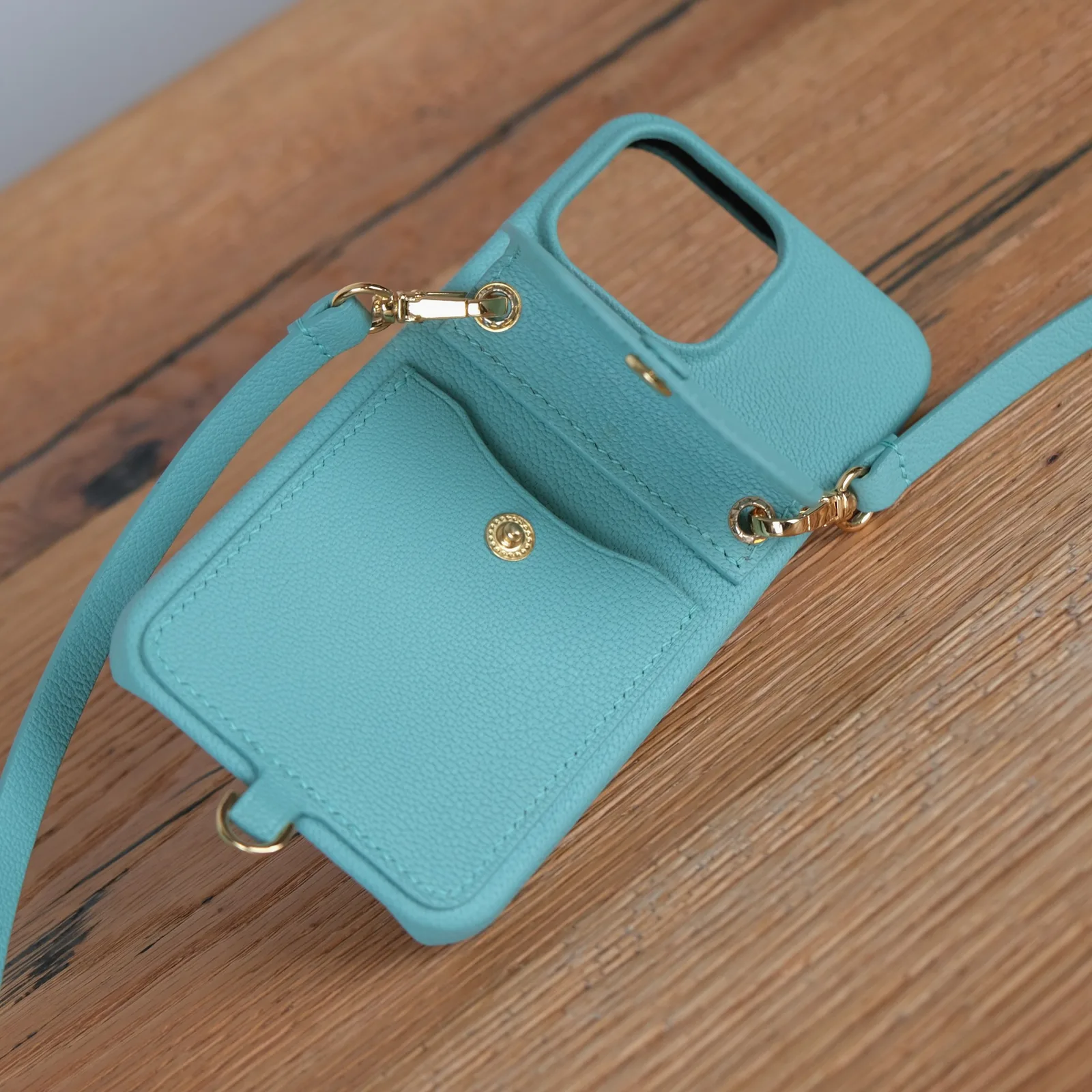 Ảnh Studio Ốp điện thoại da hạt màu teal kèm ngăn ví và dây đeo - Koi Leather